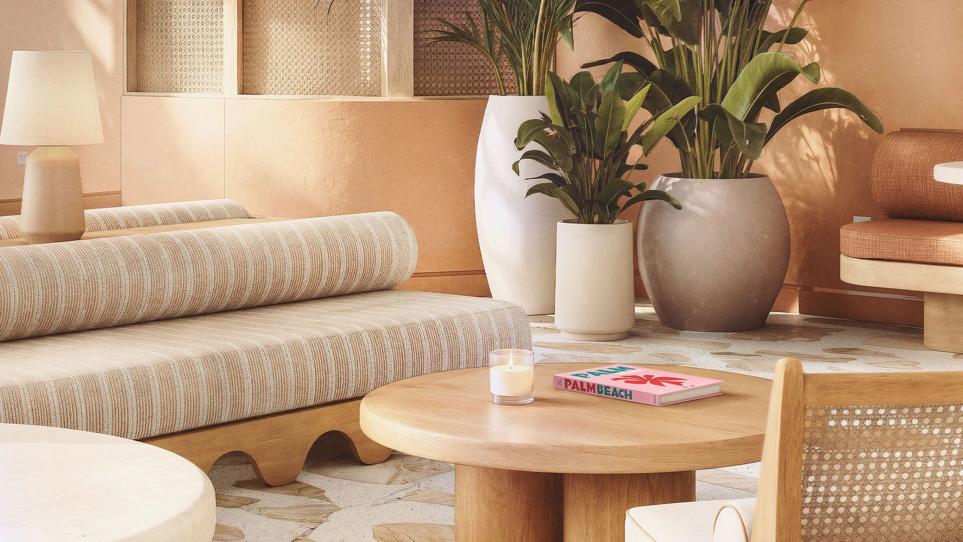 A living room with couches and tables and chairs