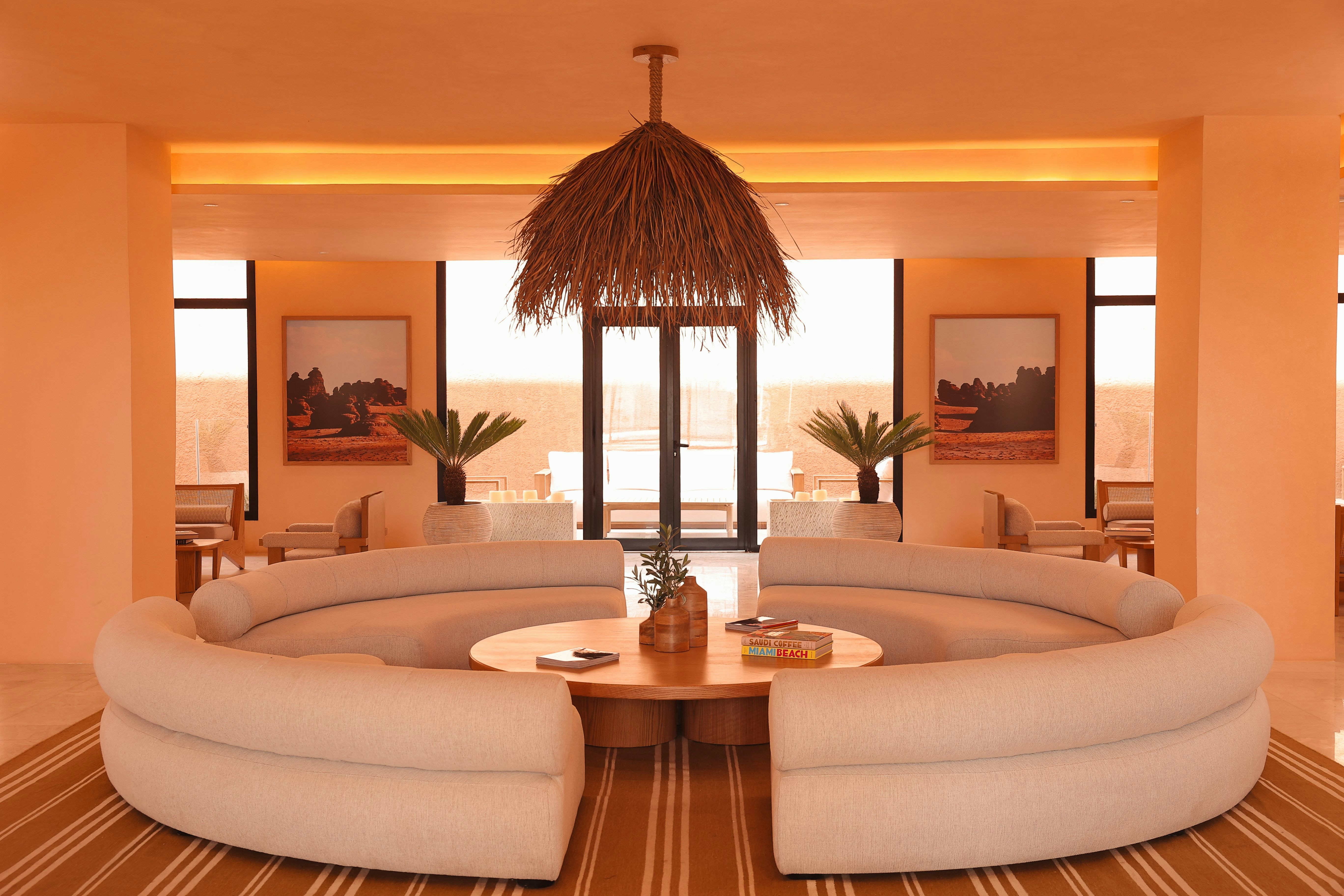 A circular couch and table in an apartment lobby