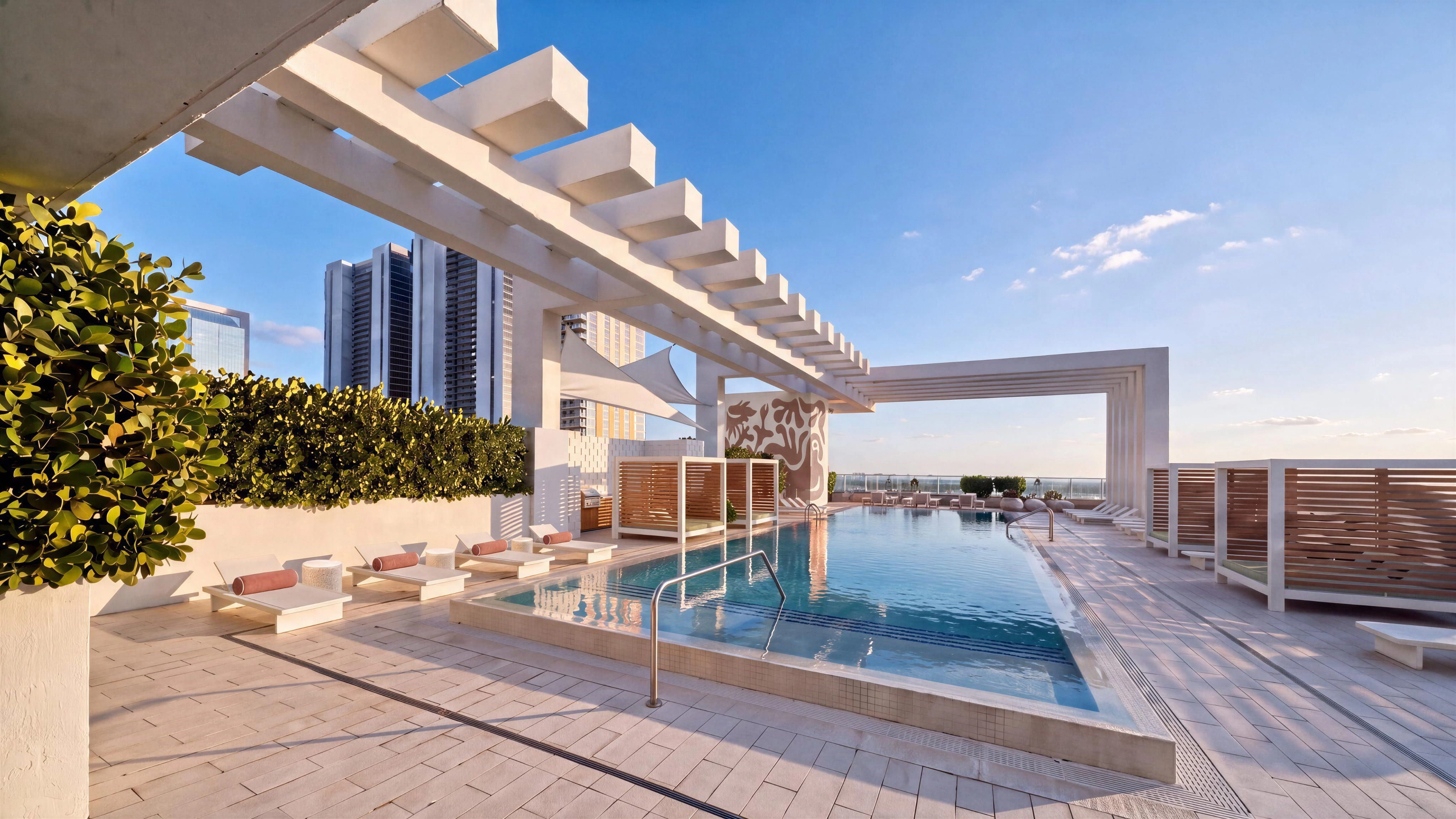 Rooftop pool with modern furniture and artwork