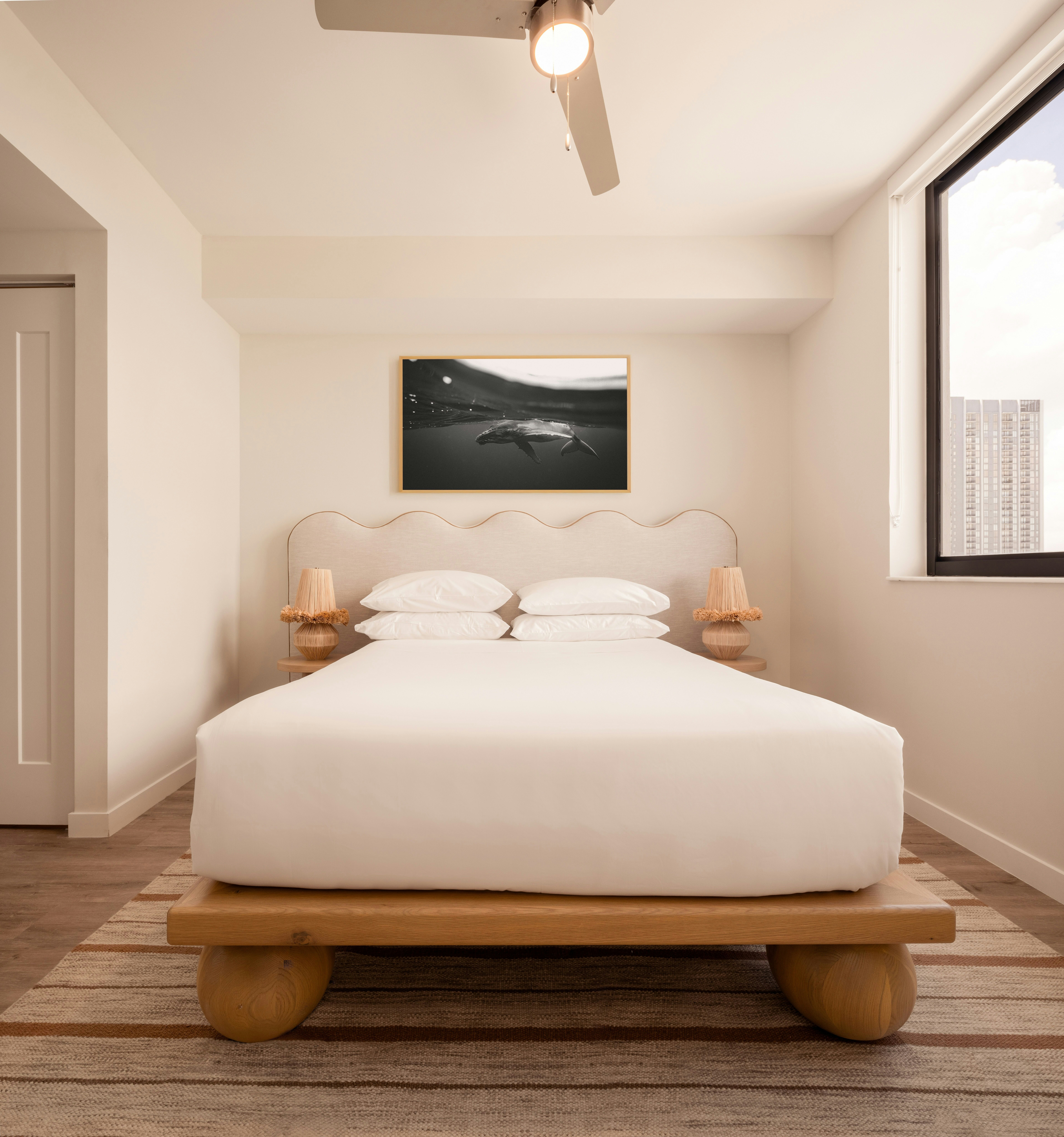 Sunlight bedroom with serene artwork